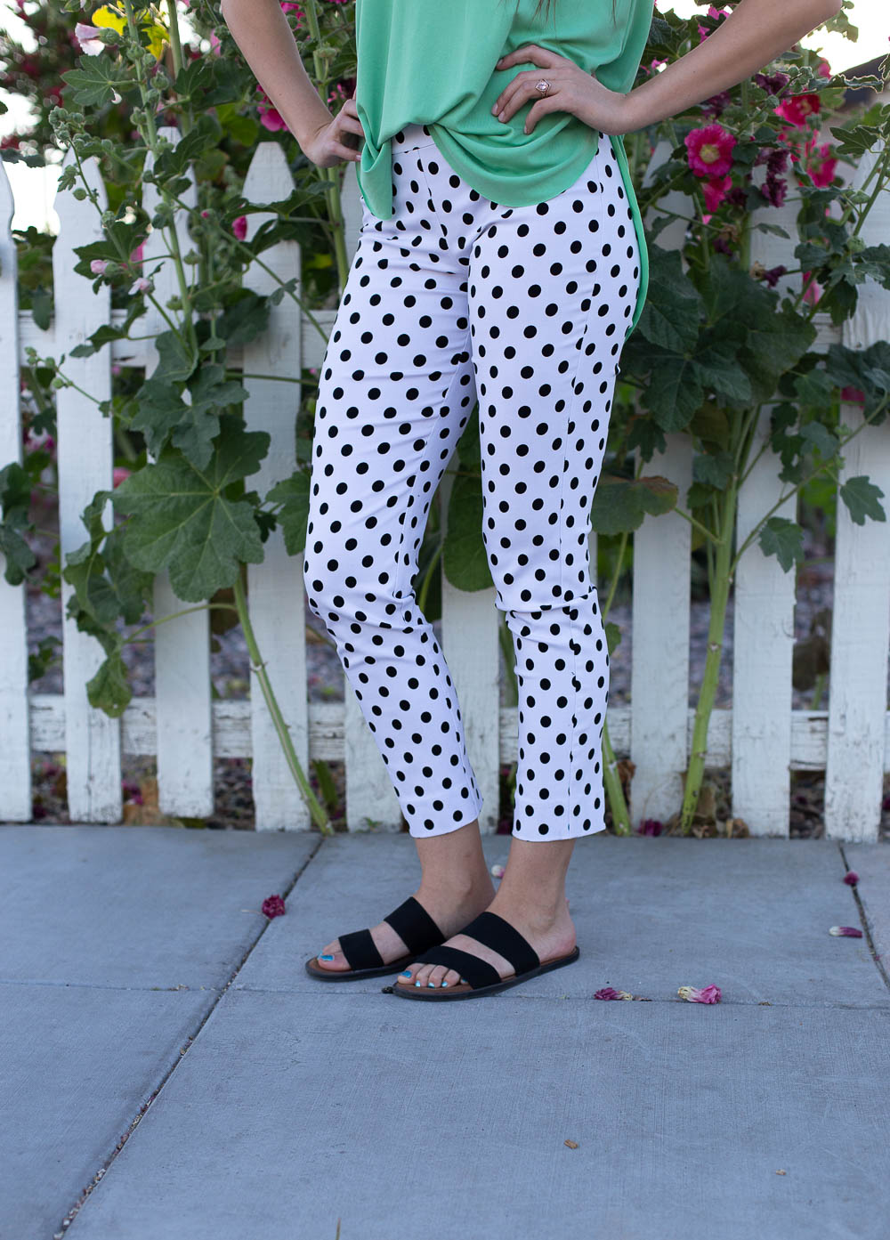 Stretch waist rayon slacks with black and white polka dots and cropped length