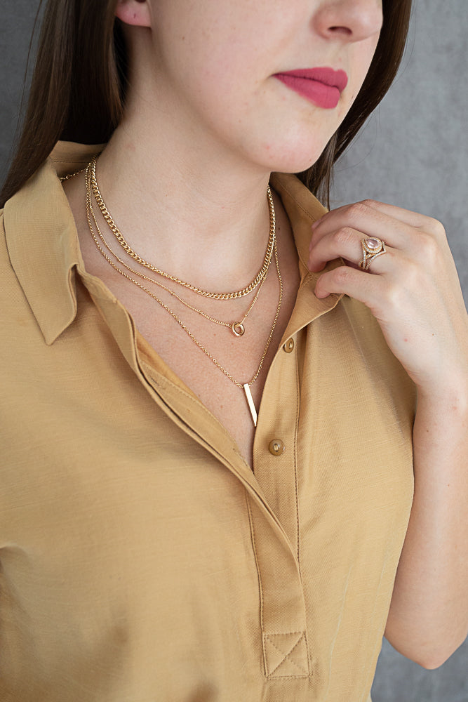 Triple layer necklace with gold bar