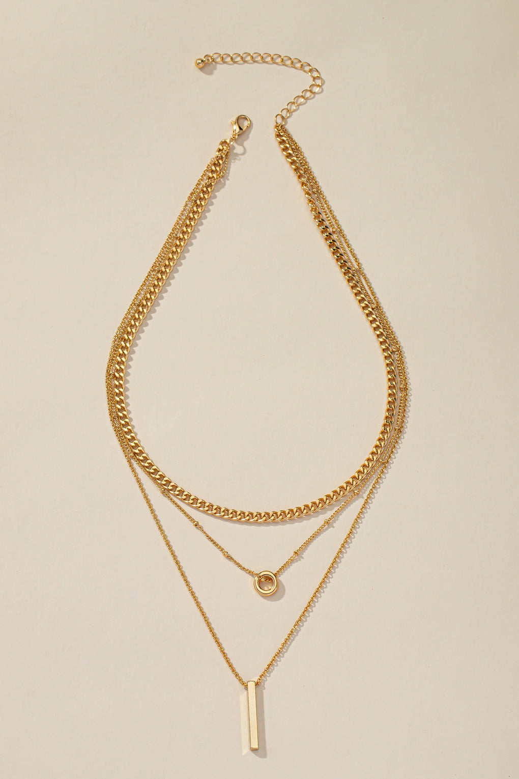 Triple layer necklace with gold bar